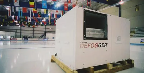 Packaged ice rink dehumidifier unit staged on the ice inside an arena